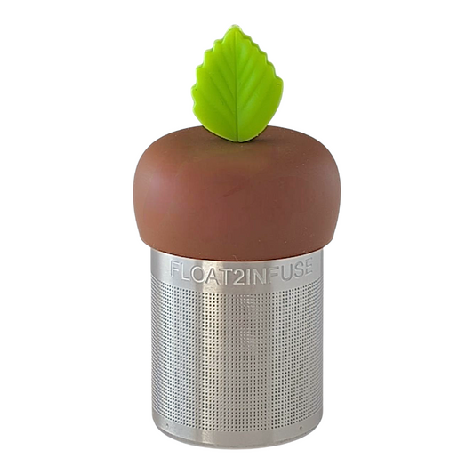 Bright green leaf tea infuser  for loose leaf tea with a fine mesh stainless steel tea strainer that reads FLOAT2INFUSE on a brown base with a white background