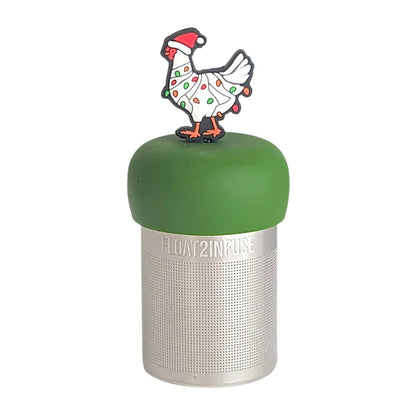 White chicken wearing a santa hat and wrapped in red and green christmas lights  tea infuser for loose leaf tea with a fine mesh stainless steel tea strainer  that reads FLOAT2INFUSE on a dark green base with a white background