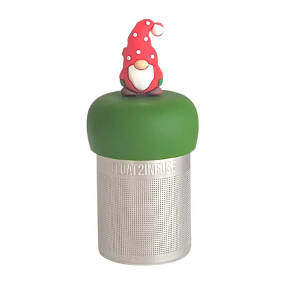 gnome with a long white beard wearing red with white polka dots on the hat and green mittens tea infuser for loose leaf tea with a fine mesh stainless steel tea strainer 
that reads FLOAT2INFUSE on a dark green base with a white background