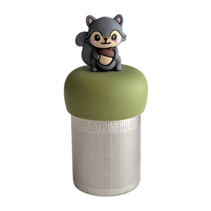 Cute 3d grey squirrel holding an acorn tea infuser for loose leaf tea with a fine mesh stainless steel tea strainer that reads FLOAT2INFUSE on a green base with a white background
