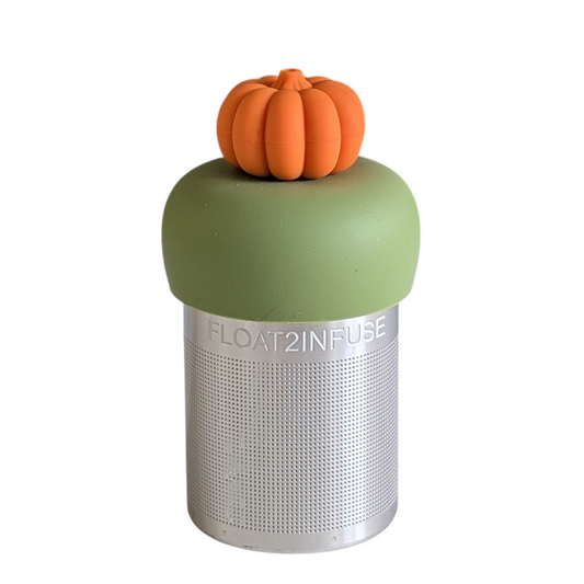 3D orange pumpkin tea infuser for loose leaf tea with a fine mesh stainless steel tea strainer that reads FLOAT2INFUSE on a green base with a white background