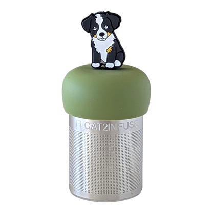 black and white boarder collie dog tea infuser for loose leaf tea with a fine mesh stainless steel tea strainer  that reads FLOAT2INFUSE on a green base with a white background