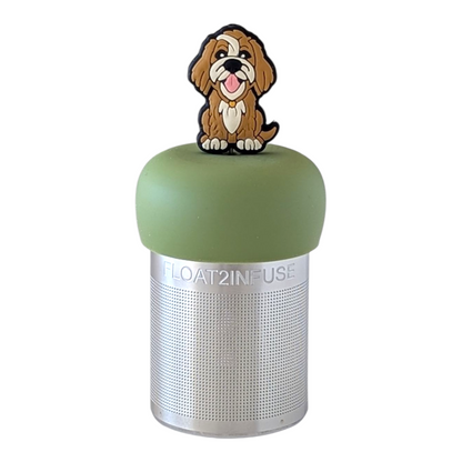 Smiling shaggy brown and white golden retriever dog tea infuser for loose leaf tea with a fine mesh stainless steel tea strainer  that reads FLOAT2INFUSE on a green base with a white background