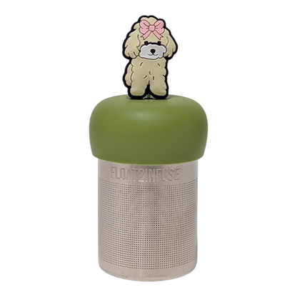 Beige poodle with pink bow tea infuser with a green base for loose leaf tea with a fine mesh stainless steel tea strainer that reads FLOAT2INFUSE with a white background
