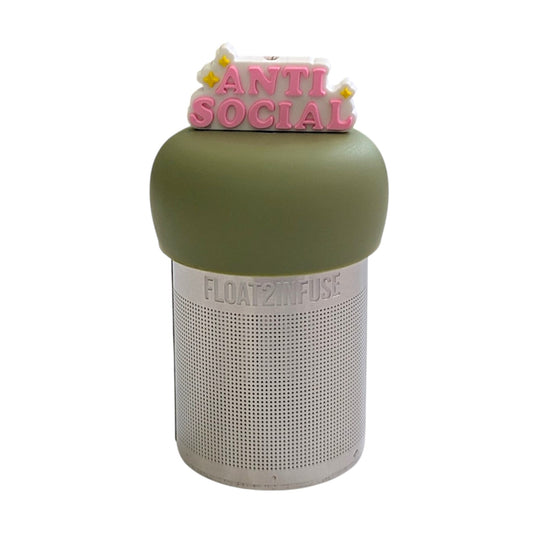 Pink text reads "antisocial" with yellow stars and white outline tea infuser for loose leaf tea with a fine mesh stainless steel tea strainer that reads FLOAT2INFUSE on a green base with a white background