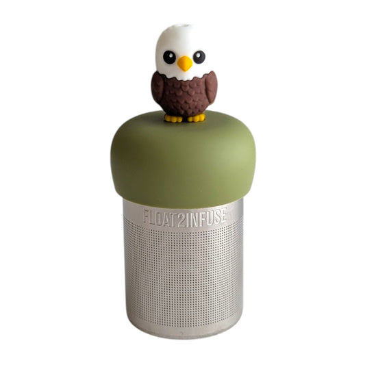 Cute bald eagle tea infuser for loose leaf tea with a fine mesh stainless steel tea strainer that reads FLOAT2INFUSE on a green base with a white background