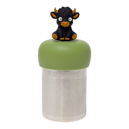 Black highland cow with some brown tea infuser  for loose leaf tea with a fine mesh stainless steel tea strainer that reads FLOAT2INFUSE on a green base with a white background
