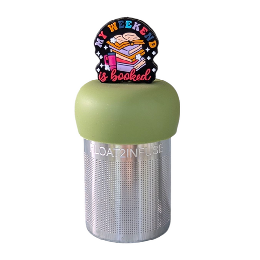 black round background with text "my weekend is booked" with a stack of books and a water bottle tea infuser  for loose leaf tea with fine mesh stainless steel tea strainer that reads FLOAT2INFUSE on a green base with a white background
