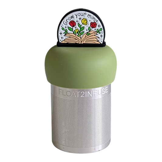 open book with flowers and text "grow your mind" tea infuser for loose leaf tea with a fine mesh stainless steel tea strainer that reads FLOAT2INFUSE on a green base with a white background 