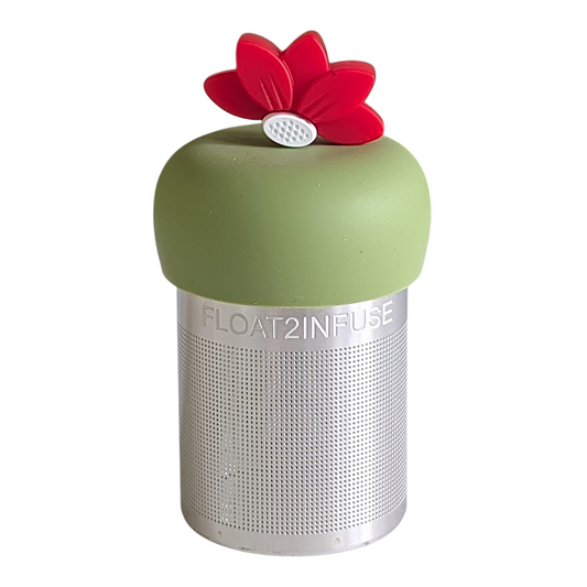 red lotus flower tea infuser for loose leaf tea with a fine mesh stainless steel tea strainer that reads FLOAT2INFUSE on a green base with a white background