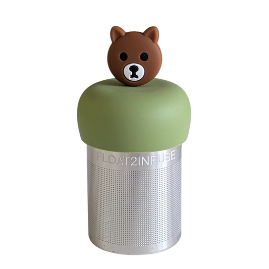 brown bear tea infuser for loose leaf tea with a fine mesh stainless steel tea strainer that reads FLOAT2INFUSE on a green base with a white background
