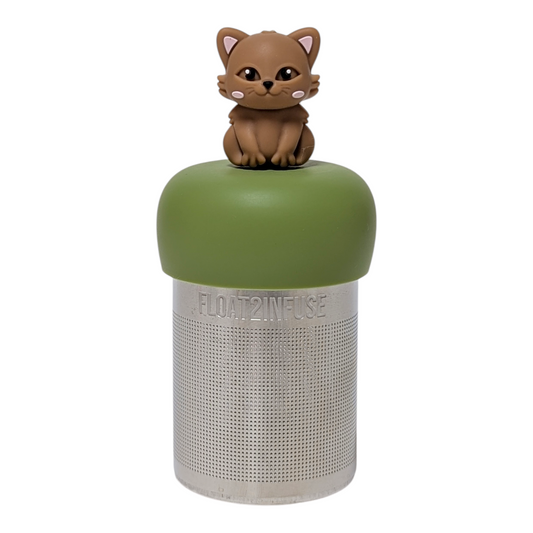 Brown cat tea infuser with a green base for loose leaf tea with a fine mesh stainless steel tea strainer that reads FLOAT2INFUSE with a white background