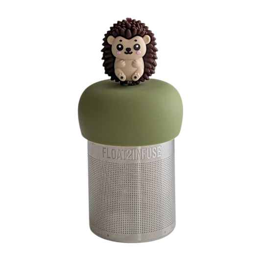 Hedgehog animal tea infuser for loose leaf tea  with a fine mesh stainless steel tea strainer that reads FLOAT2INFUSE on a green base with a white background