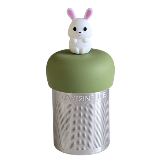cute white bunny animal with pink ears tea infuser for loose leaf tea with a fine mesh stainless steel tea strainer that reads FLOAT2INFUSE on a green base with a white background