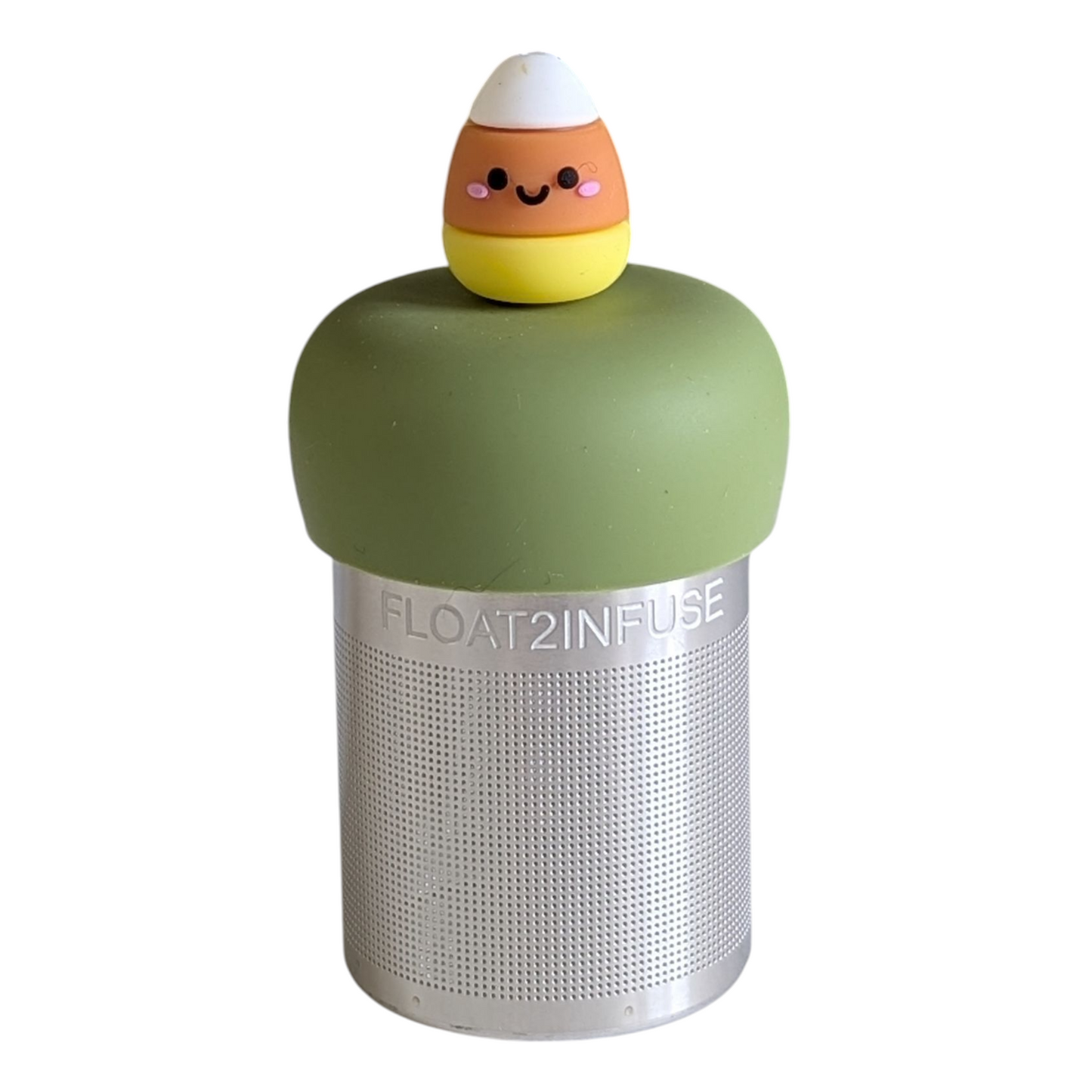 candy corn with a smiling face tea infuser for loose leaf tea with a fine mesh stainless steel tea strainer that reads FLOAT2INFUSE on a green base with a white background