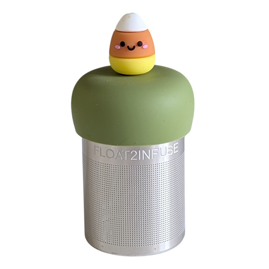 candy corn with a smiling face tea infuser for loose leaf tea with a fine mesh stainless steel tea strainer that reads FLOAT2INFUSE on a green base with a white background