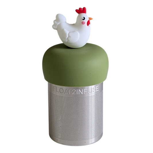 white chicken animal tea infuser for loose leaf tea on a green base with a fine mesh stainless steel strainer that reads FLOAT2INFUSE with a white background