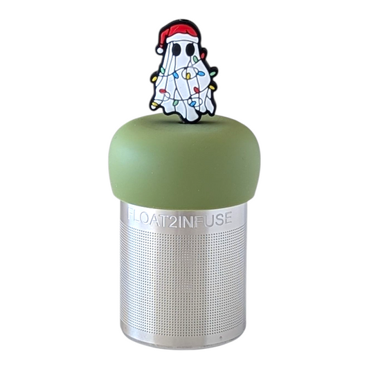 white ghost waring a santa hat and wrapped in christmas lights tea infuser for loose leaf tea with a fine mesh stainless steel tea strainer  that reads FLOAT2INFUSE on a green base with a white background