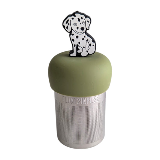 White dalmatian with black spots tea infuser  for loose leaf tea with a fine mesh stainless steel tea strainer that reads FLOAT2INFUSE on a green base with a white background
