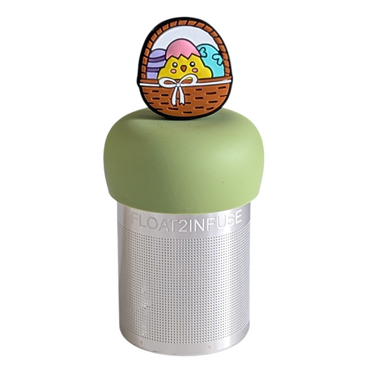 brown easter basket with baby chick and easter eggs tea infuser for loose leaf tea with a fine mesh stainless steel tea strainer that reads FLOAT2INFUSE on a green base with a white background