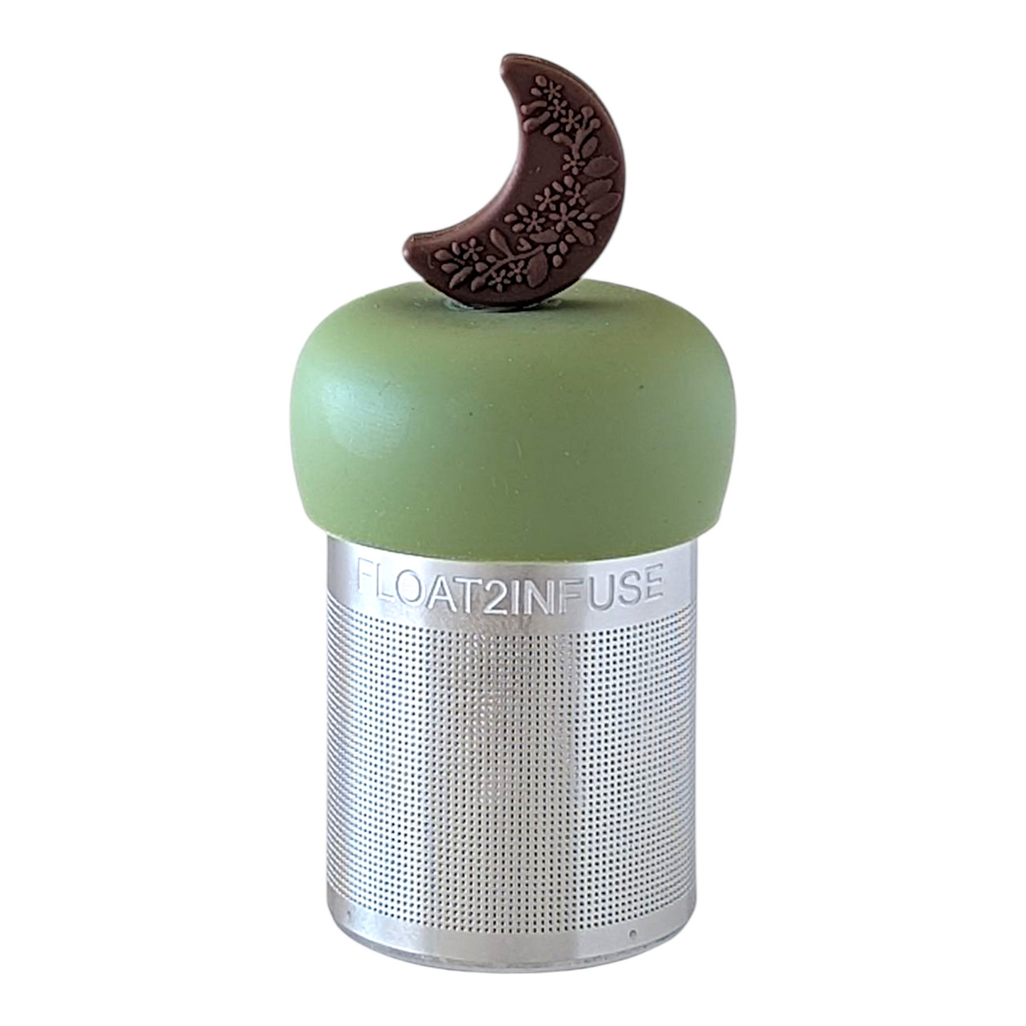 Brown crescent moon with floral pattern tea infuser for loose leaf tea with a fine mesh stainless steel tea strainer  that reads FLOAT2INFUSE on a green base with a white background