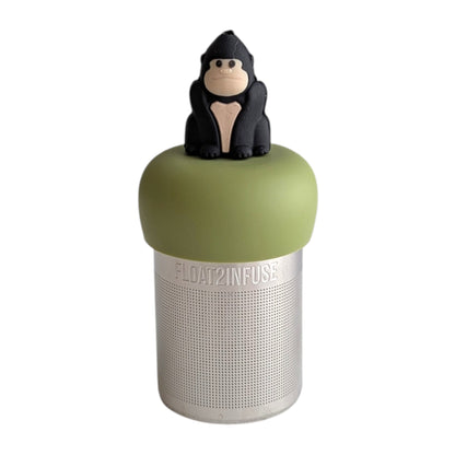 Black gorilla tea infuser for loose leaf tea with a fine mesh stainless steel tea strainer that reads FLOAT2INFUSE on a green base with a white background
