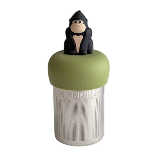 Black gorilla tea infuser for loose leaf tea with a fine mesh stainless steel tea strainer that reads FLOAT2INFUSE on a green base with a white background
