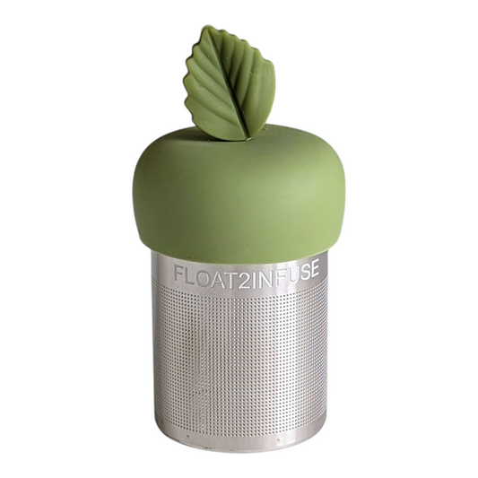 green herb leaf tea infuser for loose leaf tea with a fine mesh stainless steel tea strainer that reads FLOAT2INFUSE on a green base with a white background