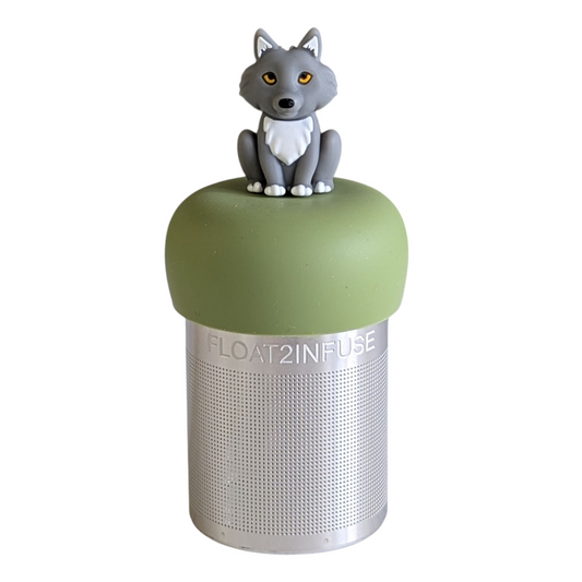 grey wolf animal tea infuser for loose leaf tea with a fine mesh stainless steel tea strainer that reads FLOAT2INFUSE on a green base with a white background