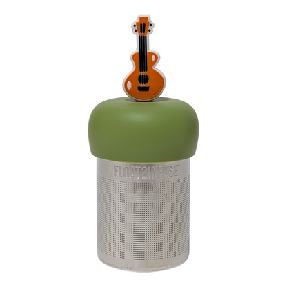 Brown guitar tea infuser  for loose leaf tea with a fine mesh stainless steel tea strainer that reads FLOAT2INFUSE on a green base with a white background