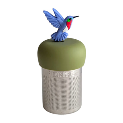 Beautiful blue hummingbird tea infuser for loose leaf tea with a fine mesh stainless steel tea strainer 
that reads FLOAT2INFUSE on a green base with a white background