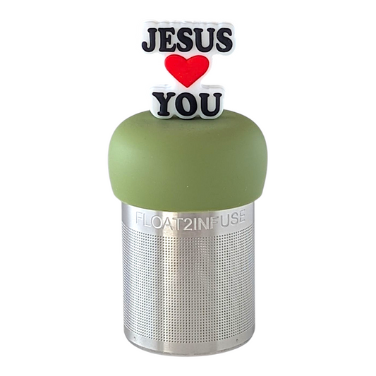 text that reads "Jesus loves you" with a heart instead of the word love tea infuser for loose leaf tea with fine mesh stainless steel tea strainer that reads FLOAT2INFUSE on a green base with a white background