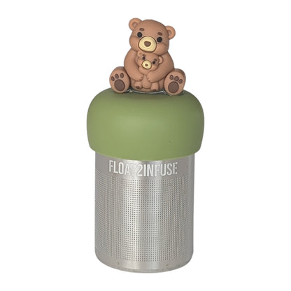 Brown bear mom holding baby bear tea infuser for loose leaf tea with a fine mesh stainless steel tea strainer that reads FLOAT2INFUSE on a green base with a white background