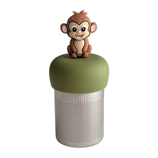 Smiling brown monkey tea infuser for loose leaf tea with a fine mesh stainless steel tea strainer 
that reads FLOAT2INFUSE on a green base with a white background