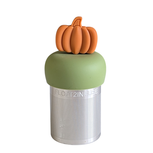 orange pumpkin tea infuser for loose leaf tea with a fine mesh stainless steel tea strainer that reads FLOAT2INFUSE on a green base with a white background