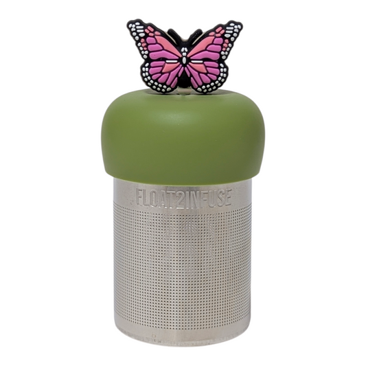 Pink butterfly tea infuser for loose leaf tea with a fine mesh stainless steel tea strainer that reads FLOAT2INFUSE on a green base with a white background
