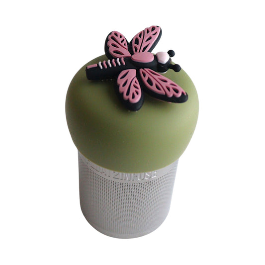 Pink dragonfly tea infuser for loose leaf tea with a fine mesh stainless steel tea strainer 
that reads FLOAT2INFUSE on a green base with a white background
