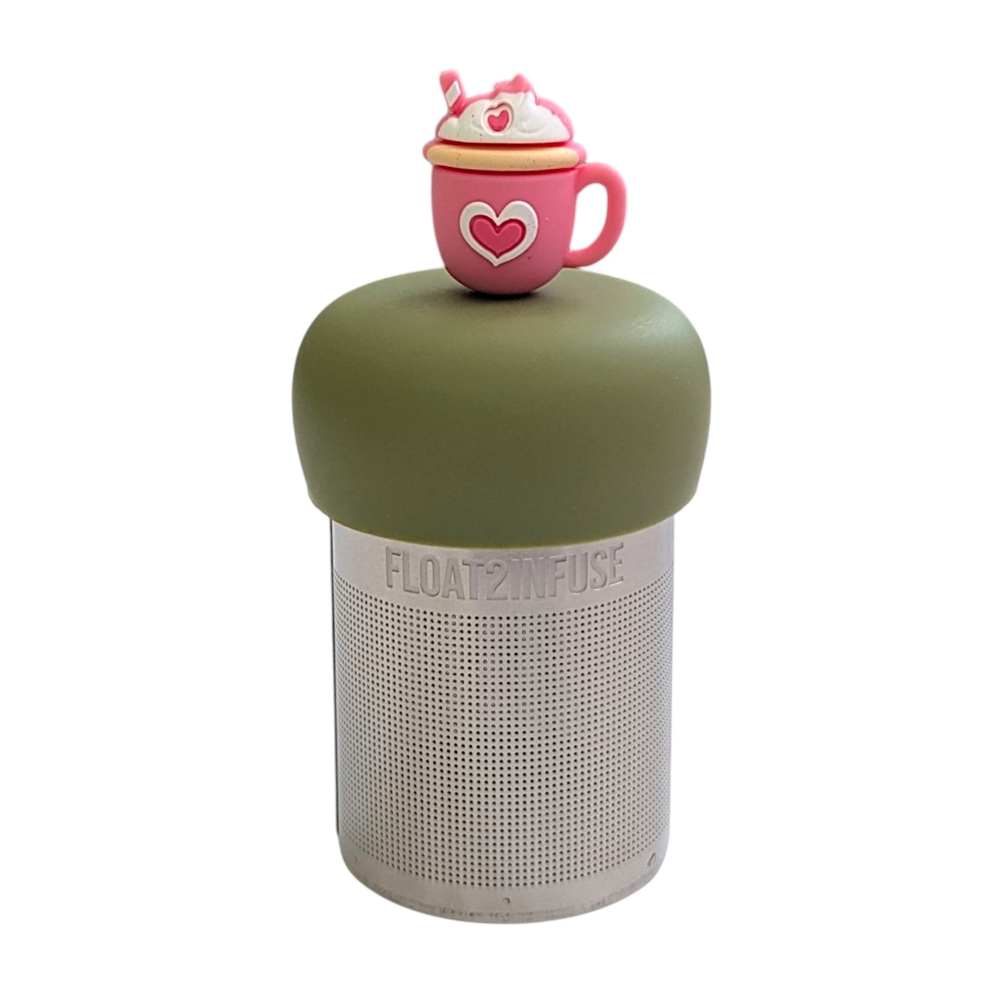 Pink tea mug with a white and pink heart in the center with whip cream and a white and pink striped straw tea infuser for loose leaf tea with a fine mesh stainless steel tea strainer that reads FLOAT2INFUSE on a green base with a white background