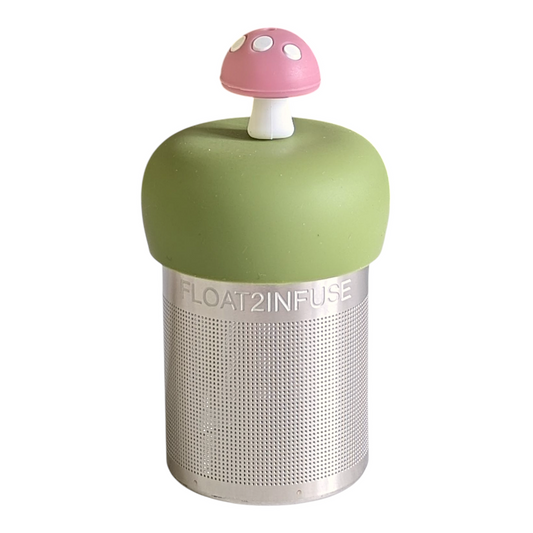light pink mushroom tea infuser for loose leaf tea with a fine mesh stainless steel tea strainer that reads FLOAT2INFUSE on a green base with a white background