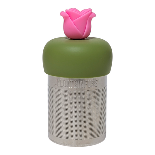 Pink rose tea infuser  for loose leaf tea with a fine mesh stainless steel tea strainer that reads FLOAT2INFUSE on a green base with a white background