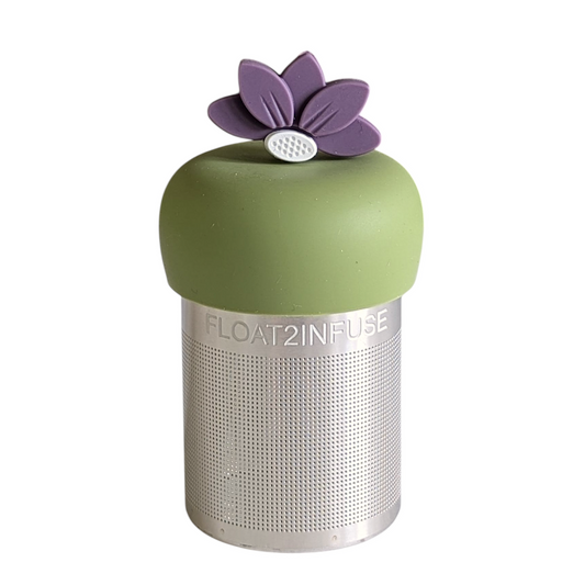 purple lotus flower tea infuser for loose leaf tea with a fine mesh stainless steel tea strainer that reads FLOAT2INFUSE on a green base with a white background