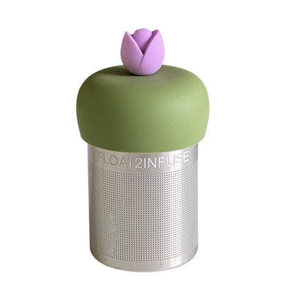 purple tulip flower tea infuser for loose leaf tea with a fine mesh stainless steel tea strainer that reads FLOAT2INFUSE on a green base with a white background