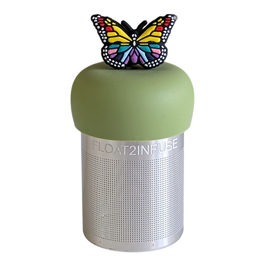 rainbow butterfly animal tea infuser for loose leaf tea with a fine mesh stainless steel tea strainer that reads FLOAT2INFUSE on a green base with a white background