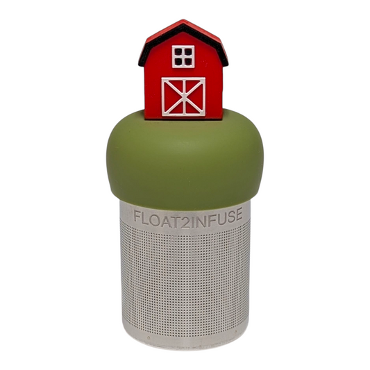 Red barn tea infuser for loose leaf tea with a fine mesh stainless steel tea strainer  that reads FLOAT2INFUSE on a green base with a white background