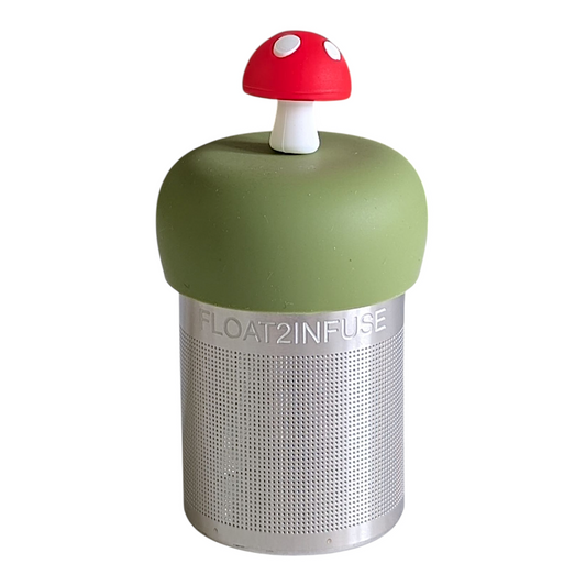 red mushroom tea infuser for loose leaf tea with a fine mesh stainless steel tea strainer that reads FLOAT2INFUSE on a green base with a white background
