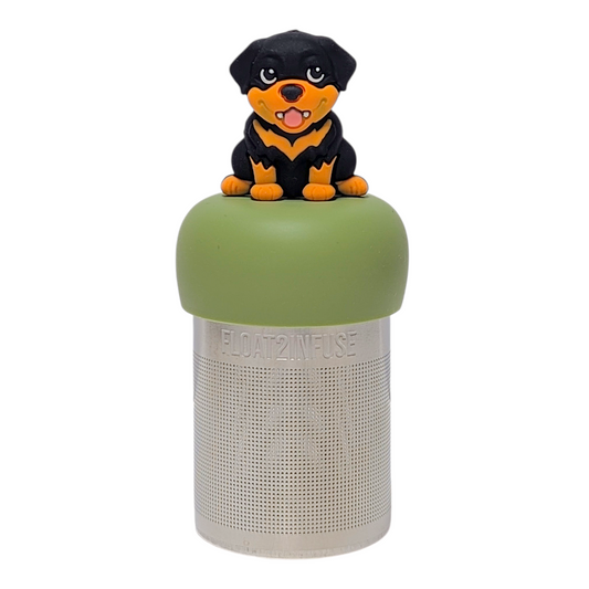 Black and orange rottweiler dog tea infuser with a green base for loose leaf tea with a fine mesh stainless steel tea strainer that reads FLOAT2INFUSE with a white background