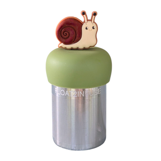 smiling beige snail with brown shell for loose leaf tea with fine mesh stainless steel tea strainer that reads FLOAT2INFUSE on a green base with white background
