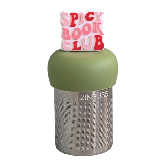 white square with red and pink text that reads "spicy book club" tea infuser  for loose leaf tea with fine mesh stainless steel tea strainer that reads FLOAT2INFUSE on a green base with white background