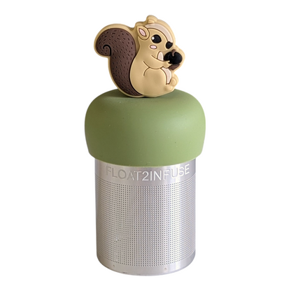 squirrel animal holding an acorn  tea infuser for loose leaf tea with a fine mesh stainless steel tea strainer that reads FLOAT2INFUSE on a green base with a white background