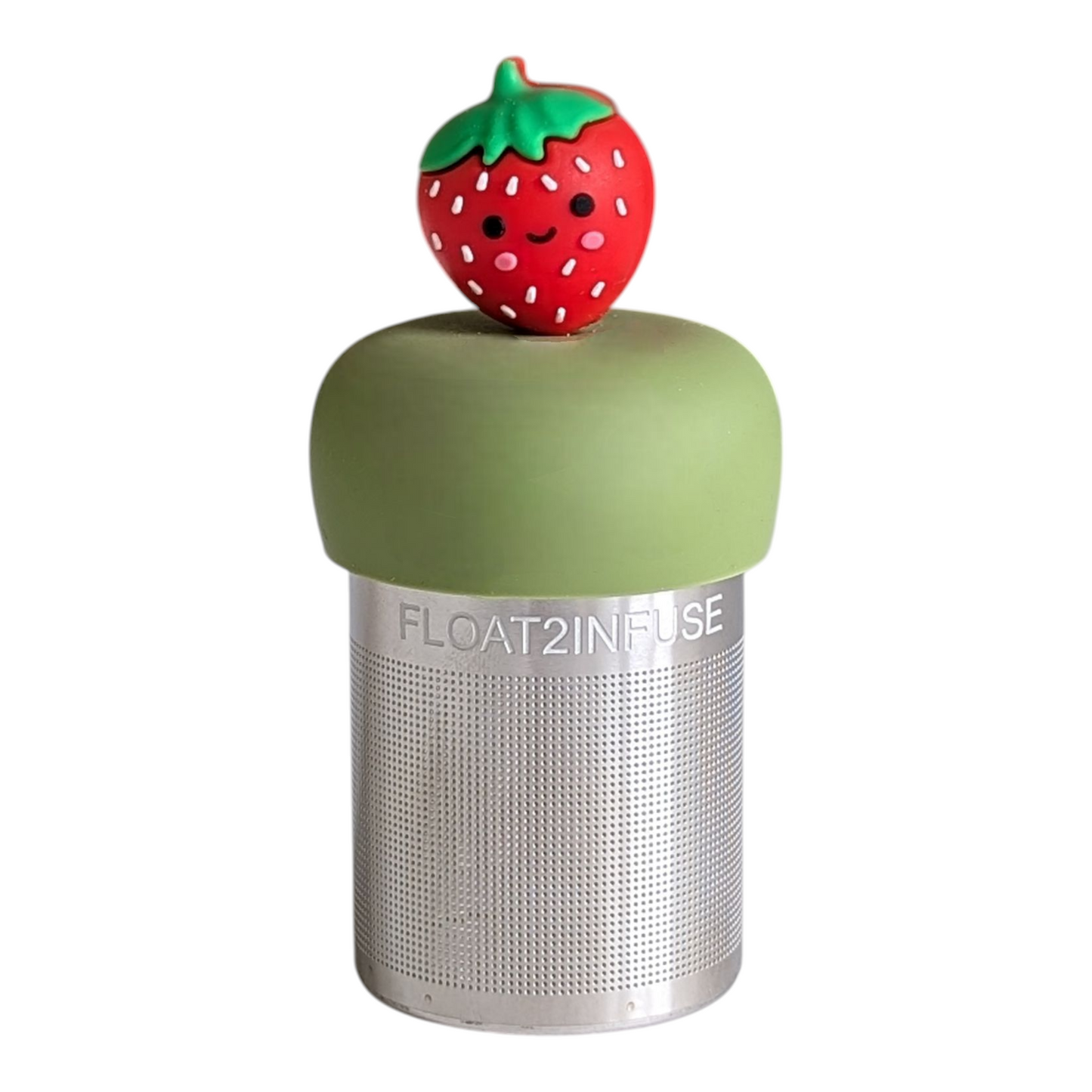 red smiling strawberry tea infuser for loose leaf tea with a fine mesh stainless steel tea strainer that reads FLOAT2INFUSE on a green base with a white background